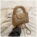 Close-up of beige quilted bag with gold turn-lock closure and chunky top handle - Khaki