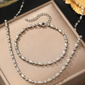 Silberne Perlen-Schmucksets mit polierten runden und ovalen Perlen auf Edelstahlketten - Silberset (Halskette + Armband) (C5276)