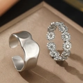 Set of silver stainless steel rings featuring wavy texture and daisy floral patterns - Silver Daisy Hammered Style (C9188)