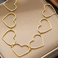 Detailed view of hollow heart links on a gold-plated stainless steel chain necklace - Gold Style (C6065)