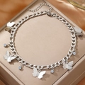 Minimalist stainless steel butterfly anklet with crystals on champagne silk display - Silver Butterfly Style (C5134)