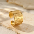 Macro detail of 18K gold plated wide band ring featuring a unique bark texture design - Golden Wide Tree Bark Texture Style (C3689)