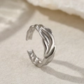 Macro shot of silver open ring with twisted wave texture and high-gloss metallic finish - Silver Irregular Forged Wave Style (C2092)
