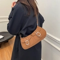 Brown leather crossbody bag with dual front pockets and silver buckles for women - Brown