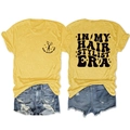 Front and back view of yellow hair stylist t-shirt with retro typography and denim shorts - S / Tops / Yellow