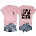 Flat lay of pink heather t-shirt with In My Hair Stylist Era vintage typography and scissors - S / Tops / Pink