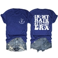 Detailed view of the hair stylist graphic print on the front and back of this blue T-shirt - S / Tops / Vintage Blue
