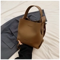 Brown lychee grain leather bucket bag with wide handle strap and logo detail - Brown