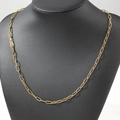 Polished gold rectangular link chain necklace displayed on a black neck bust stand - 50cm / Gold