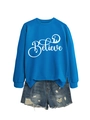 Detail of royal blue Believe sweatshirt with Nativity silhouette and distressed denim shorts - S / Lake Blue with White Graphic