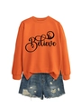 Close-up of bright orange sweatshirt featuring black Believe print and nativity silhouette - S / Orange with Black Graphic
