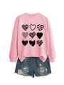 Detailed view of pink crewneck sweatshirt with nine black hearts and distressed denim shorts - Pink (Black Print)