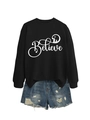 Detail of Believe text and nativity silhouette print on black long sleeve crewneck sweatshirt - S / Black with White Graphic