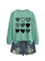 Flat lay of mint green sweatshirt with nine heart patterns and distressed denim shorts - Light Green (Black Print)
