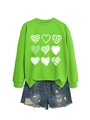 Detail of lime green sweatshirt with white heart prints and distressed denim shorts - Fluorescent Green (White Print)