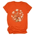 Detail of orange crew neck T-shirt featuring a circular floral print and soft fabric texture - Orange