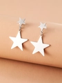 Detailed close-up of polished silver star earrings with a double pentagon dangle design - Silver