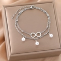 Double-layered infinity link bracelet with white pearl charms in polished stainless steel - Silver (B4256)