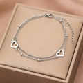 Detail view of a double-layered stainless steel heart bracelet with polished silver finish - Silver Style (B4616)