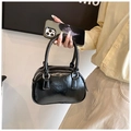 Glossy black mini bowling handbag with silver hardware and chic top handles - Black