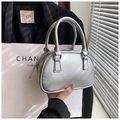 Chic silver bowling handbag with metallic texture and sleek double handles - Silver