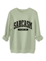 Detail view of sage green sweatshirt featuring black Sarcasm slogan text and ribbed cuffs - Olive Green