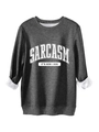 Detail of dark grey sweatshirt showing soft white fleece lining and slogan print - Dark Gray
