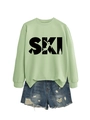 Detail of light green sweatshirt with SKI graphic and blue distressed denim shorts - S / Olive Green (Black Print)