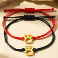 Adjustable red and black braided cord bracelets with golden hollow cat paw pendants - Gold Cat Paw Style (C6739)