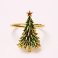 Close-up of a Christmas tree napkin ring with green enamel and red rhinestones - Golden Christmas Tree