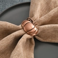 Antique bronze pumpkin napkin ring on a beige linen napkin for harvest table decor - Antique Copper