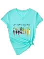 Detail of V-neck mint green t-shirt with watercolor vegetable print and front knot tie - Deep Water Blue (Black Graphic)