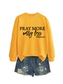 Flat lay of yellow Pray More Worry Less sweatshirt paired with denim shorts for women - S / Yellow (Black Font)