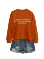 Detail of rust orange crewneck sweatshirt with slogan and blue distressed denim shorts - Burnt Orange (White Font)