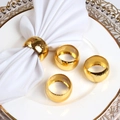 Elegant gold hammered metal napkin rings set on white ceramic plate for table decor - Gold Hammered (Set of 4)