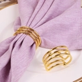 Elegant semi-circular spring metal napkin rings in gold finish for luxury dining decor - Gold
