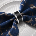 Modern black napkin ring with silver metal edges on a blue napkin and ceramic plate - Silver Trim Napkin Ring