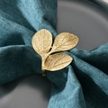 Golden leaf napkin ring with realistic vein textures on dark blue linen napkin - Matte Gold