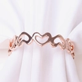 Rose gold heart napkin ring holder with interconnected hollow hearts for table decor - Rose Gold
