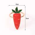 Carrot-shaped napkin ring with red enamel and green leaves on a gold band, 4cm by 6cm - Golden Carrot