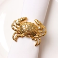 Golden crab metal napkin ring on white fabric for elegant dining table decoration - Gold