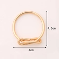 Gold metal bowknot napkin ring for hotel dining, measuring 4.5cm by 4cm in size - Metal Bowknot / Gold