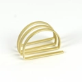 Macro detail of gold triple-layered arched napkin ring with a sleek matte metal finish - D-Shape Hollow Style / Gold