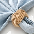 Handwoven hemp rope napkin ring in natural wood tone on linen napkin and ceramic plate - Natural Wood Color