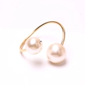 Elegant gold napkin ring with dual large pearls and sparkling rhinestone accents - With Zirconia