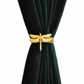 Golden dragonfly curtain tieback with elastic metal spring on dark green fabric - Dragonfly Curtain Tieback