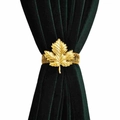 Detail of golden maple leaf metal curtain tieback with flexible elastic spring band - Maple Leaf Curtain Tieback