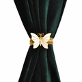 Elegant gold butterfly curtain tieback with white wings and crystals on green velvet - Butterfly Curtain Tieback