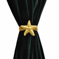 Golden starfish metal spring curtain tieback clip on elegant dark green velvet fabric - Starfish Curtain Tieback