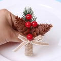 Christmas pinecone napkin ring with red berries, green pine needles and burlap bow decoration - Pine Cone Bow Style